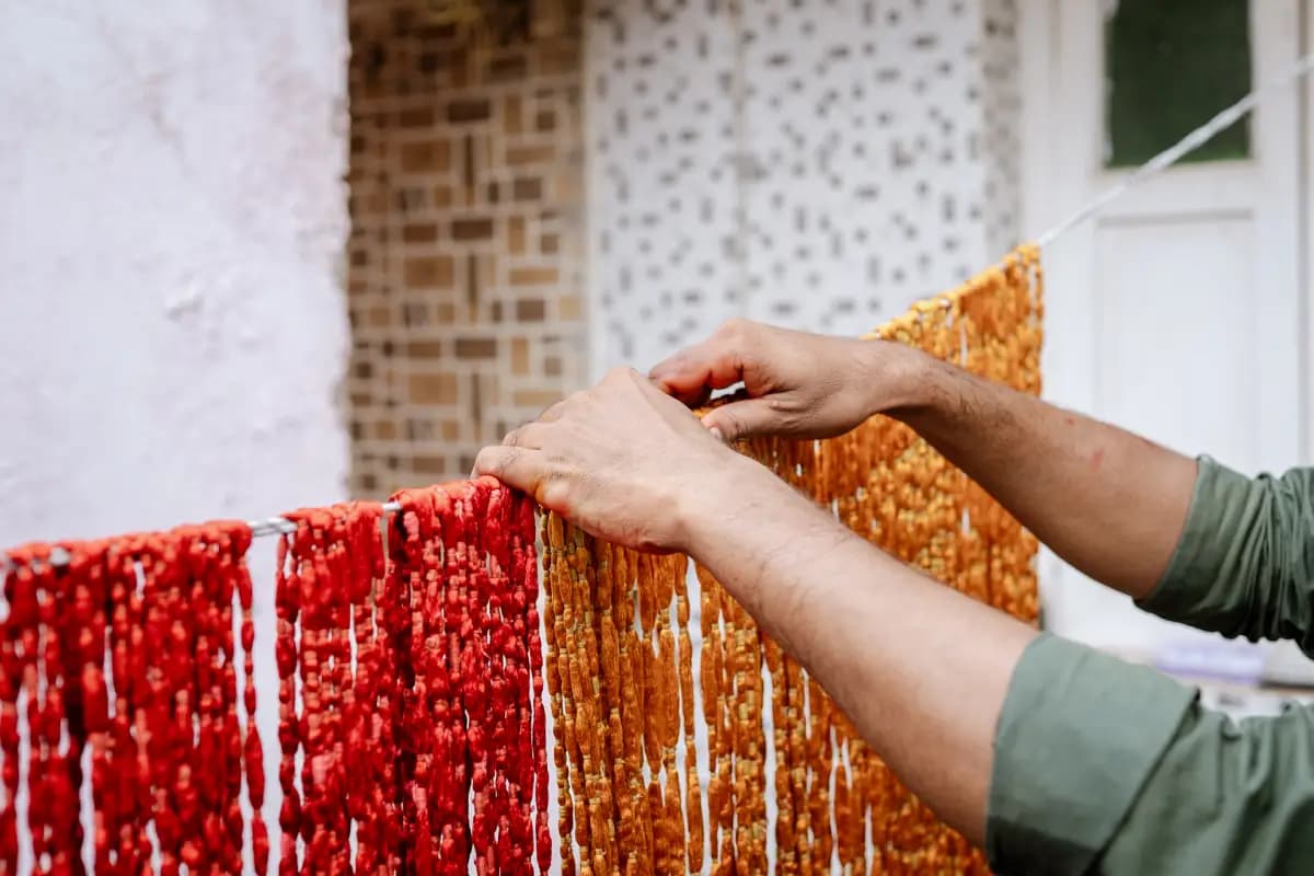 A model wearing a modern Patola gown by The House of Patola, blending traditional craftsmanship from Gujarat with contemporary sustainable fashion design.