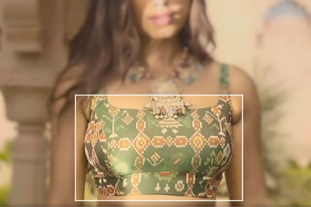 Traditional Patola fabric displaying intricate double ikat patterns, rich colours, and symmetrical motifs woven by skilled artisans in Patan Gujarat.