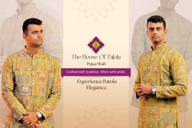 Close up of Patola silk fabric showing natural dye colours in traditional double ikat patterns with rich red, mustard, and green tones.